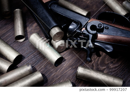 Vintage retro shotgun with brass cartridges 99917207
