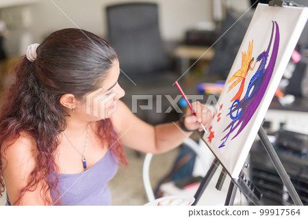 Painting artwork leisure at home. Enjoy weekend hobby. South american venezuelan mid woman close-up 99917564