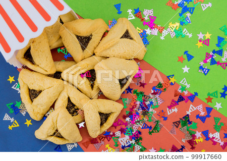 Many families bake hamantaschen cookies together as way to commemorate Jewish holiday enjoy sweet treat. 99917660