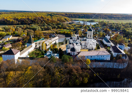 A picturesque aerial view from the side of the ponds of the ancient Orthodox Borovsko-Pafnutevsky monastery. Borovsk, Kaluga region, Russia A picturesque aerial view from the side of the ponds of the ancient Orthodox Borovsko-Pafnutevsky monastery. Borovsk, Kaluga region, Russia 99919841