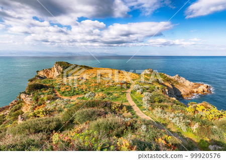 Amazing spring sunrise on the the cape Milazzo. 99920576