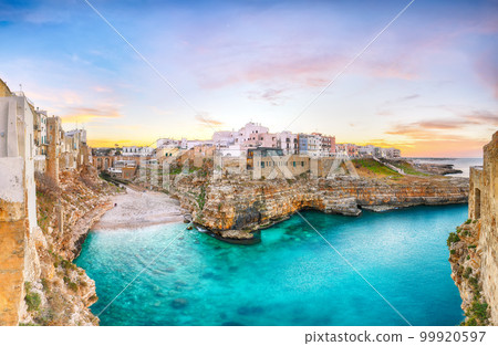 Stunning sunset at Cala Paura gulf with Bastione di Santo Stefano and Lama Monachile beach in background. Stunning sunset at Cala Paura gulf with Bastione di Santo Stefano and Lama Monachile beach in background. 99920597