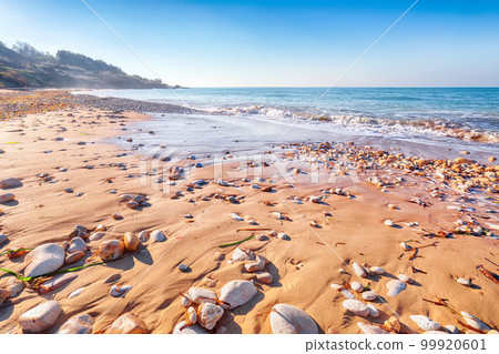Fabulous view azure sea glowing by sunlight. Dramatic morning scene Fabulous view azure sea glowing by sunlight. Dramatic morning scene 99920601