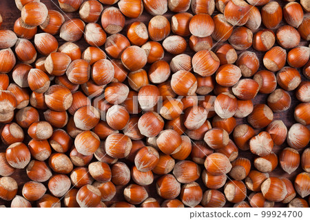 Hazelnuts as background closeup Hazelnuts as background closeup 99924700