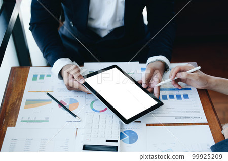 business group people meet and discuss to plan a marketing strategy and come to a conclusion on how to use the financial budget to avoid investment risks holding tablet computer blank screen. business group people meet and discuss to plan a marketing strategy and come to a conclusion on how to use the financial budget to avoid investment risks holding tablet computer blank screen. 99925209