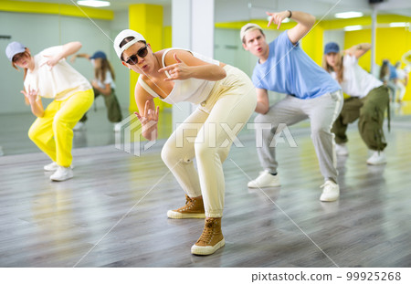 Young girl in sunglasses dancing modern dance 99925268