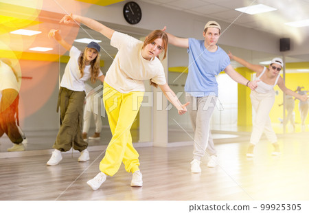 Teen girl dancing modern dances in dance studio 99925305