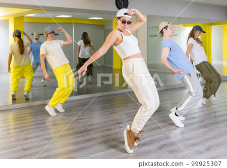 Young girl in sunglasses dancing modern dance Young girl in sunglasses dancing modern dance 99925307