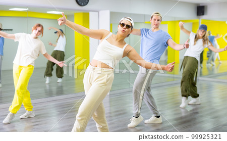 Young girl in sunglasses dancing modern dance Young girl in sunglasses dancing modern dance 99925321