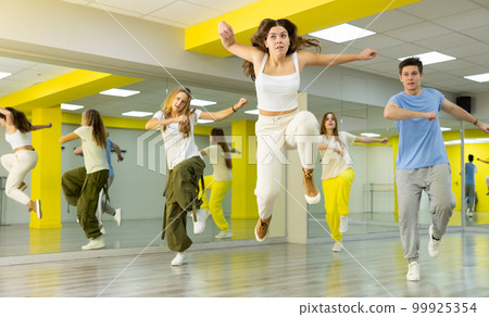 Young girl dancing modern dance in studio 99925354