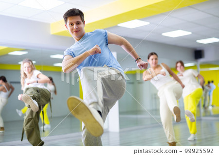 Portrait of teenager boy performing hip hop at dance class Portrait of teenager boy performing hip hop at dance class 99925592