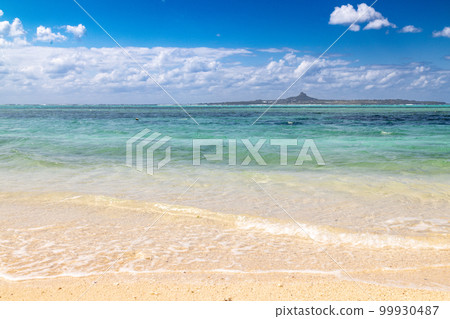 Beautiful tropical emerald blue sea and white sandy beach Beautiful tropical emerald blue sea and white sandy beach 99930487