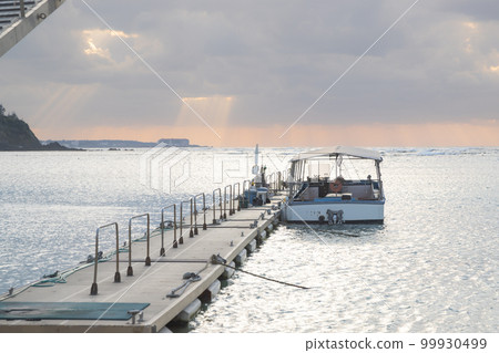 A quiet sea at sunset in a southern country 99930499