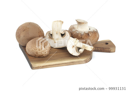 Brown button mushrooms over white background Brown button mushrooms over white background 99931131