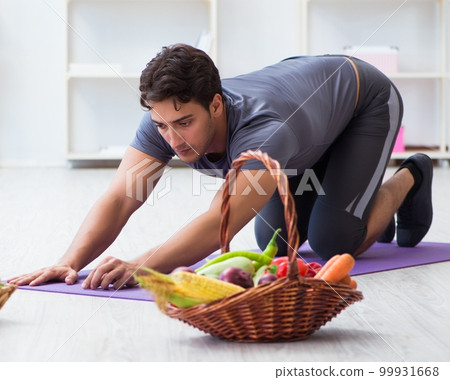 Man promoting the benefits of healthy eating and doing sports Man promoting the benefits of healthy eating and doing sports 99931668