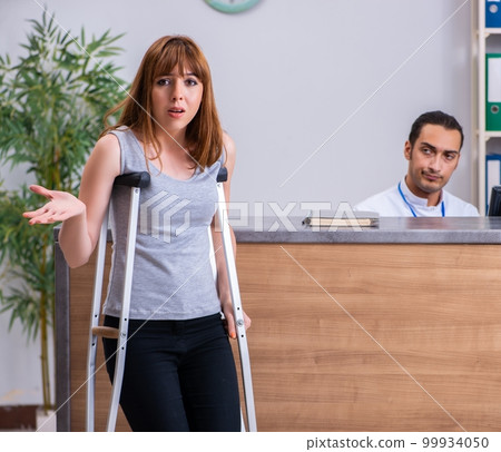 Young patient at the reception in the hospital Young patient at the reception in the hospital 99934050