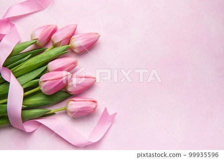 Bouquet of pink tulips on pink background. 99935596