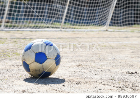 A soccer ball on an empty field A soccer ball on an empty field 99936597