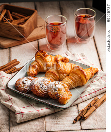 Freshly baked croissants and buns 99936727