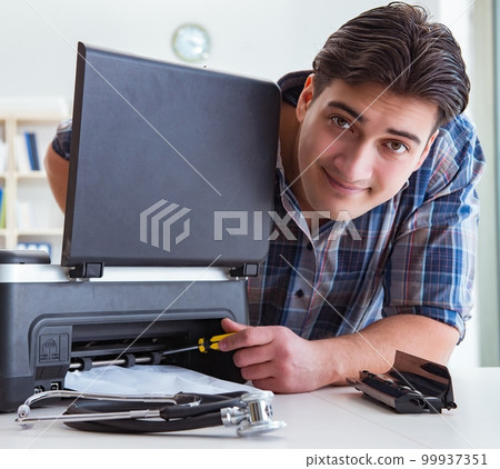 Repairman repairing broken color printer Repairman repairing broken color printer 99937351