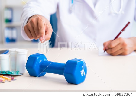 Young male doctor in sport and dieting concept 99937364