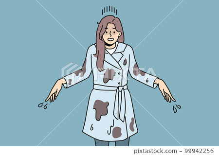 Stressed woman in mud after falling in puddle  99942256