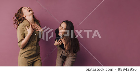Portrait of two young happy girls, studio shoot, Portrait of two young happy girls, studio shoot, 99942956