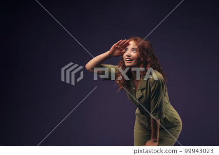 Portrait of young redhead woman, studio shoot. Portrait of young redhead woman, studio shoot. 99943023
