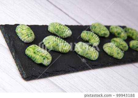 Pile of green spinach gnocchi potato peru italian food, Homemade 99943188
