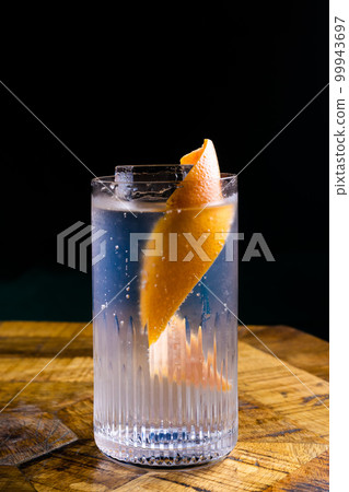 Stemmed cocktail glass with alcoholic drink, close-up isolated on black. Template design 99943697
