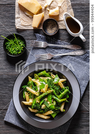 Pasta primavera with green veggies, cheese in bowl Pasta primavera with green veggies, cheese in bowl 99944404