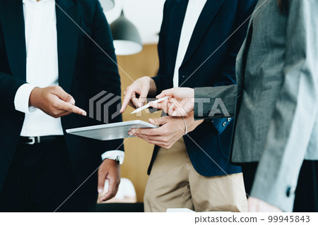 Business group people meeting and discuss to come up with conclusions on market, investment and marketing planning based on the financial budget provided by the company. Business group people meeting and discuss to come up with conclusions on market, investment and marketing planning based on the financial budget provided by the company. 99945843