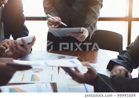 Business group people meeting and discuss to come up with conclusions on market, investment and marketing planning based on the financial budget provided by the company. Business group people meeting and discuss to come up with conclusions on market, investment and marketing planning based on the financial budget provided by the company. 99945884