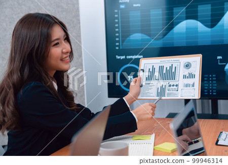 Business team of financial data analysis meeting report paper in harmony office. 99946314
