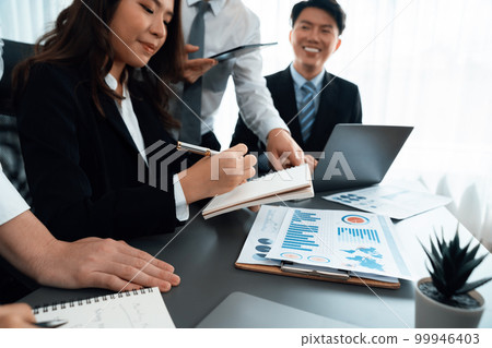 Business team of financial data analysis meeting report paper in harmony office. 99946403