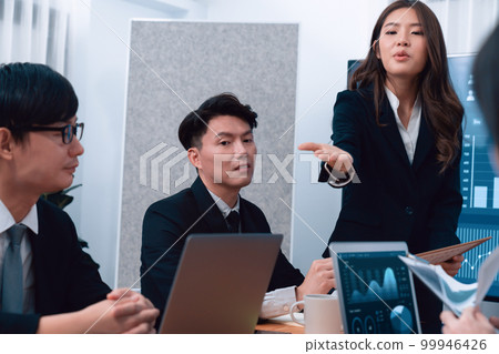 Businesswoman give presentation on dashboard data on screen at harmony office. 99946426