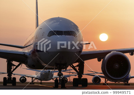 Haneda Airport, an airplane standing with the morning sun 99949571