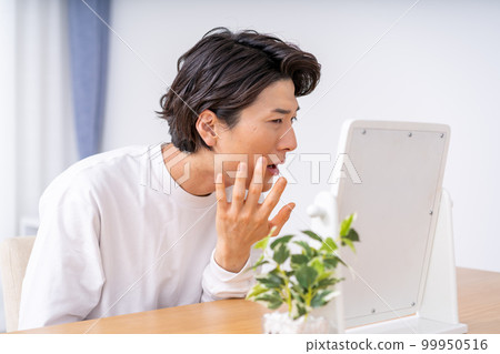 A man who is shocked by the condition of his skin A man who is shocked by the condition of his skin 99950516
