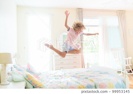 Child playing in bed. Kids room. Boy at home. Child playing in bed. Kids room. Boy at home. 99953145