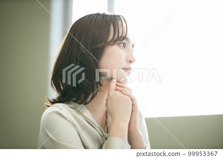 Young woman working in the office Young woman working in the office 99953367