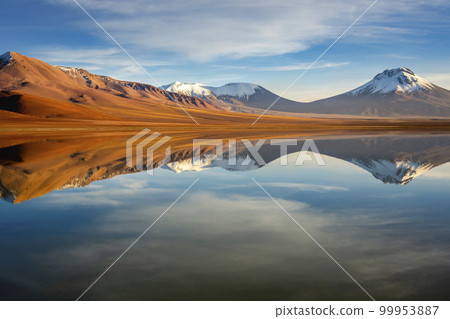 Salt lake Lejia reflection, idyllic volcanic landscape at Sunset, Atacama, Chile 99953887