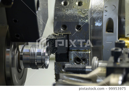 The multi-tasking CNC lathe machine swiss type thread cutting the metal pipe parts. 99953975