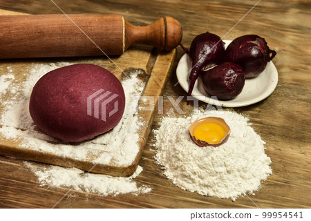 Purple dough bun for noodles with ingredients on the table. 99954541