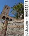 Bell tower and walls of Santa Maria Church, Velez Malaga, Spain 99955248