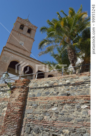 Bell tower and walls of Santa Maria Church, Velez Malaga, Spain 99955248