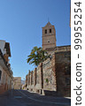 Bell tower and walls of Santa Maria Church a sunny day, Velez Malaga 99955254