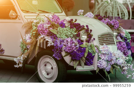 retro car with flowers retro car with flowers 99955259