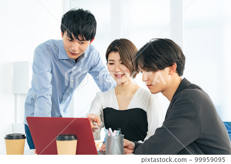 A group of young men and women in a meeting Generation Z A group of young men and women in a meeting Generation Z 99959095