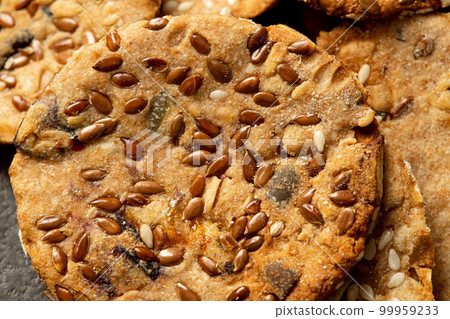 Close up, Gluten Free, Healthy cookies made with whole grain flour and flax, sunflower, pumpkin and sesame seeds. Natural home food products for your health suitable for vegans. Close up, Gluten Free, Healthy cookies made with whole grain flour and flax, sunflower, pumpkin and sesame seeds. Natural home food products for your health suitable for vegans. 99959233