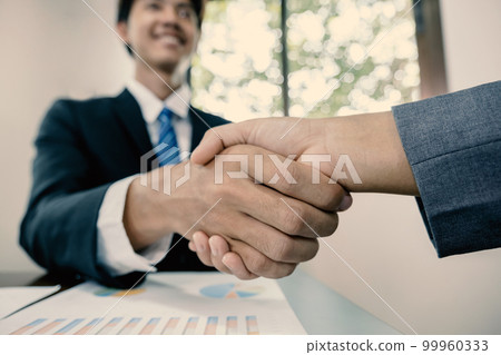 hands shake after business office executives are interviewing job applicants in the meeting room 99960333